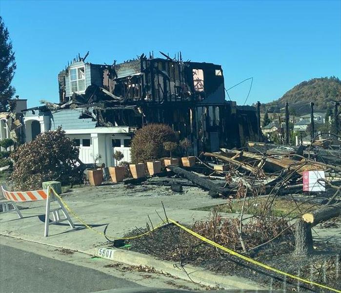 Home with severe exterior fire damage.