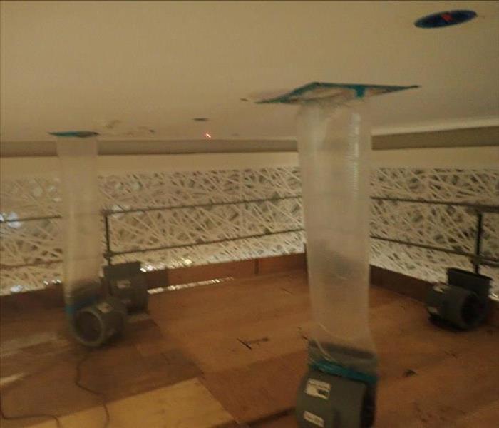 Air movers drying.