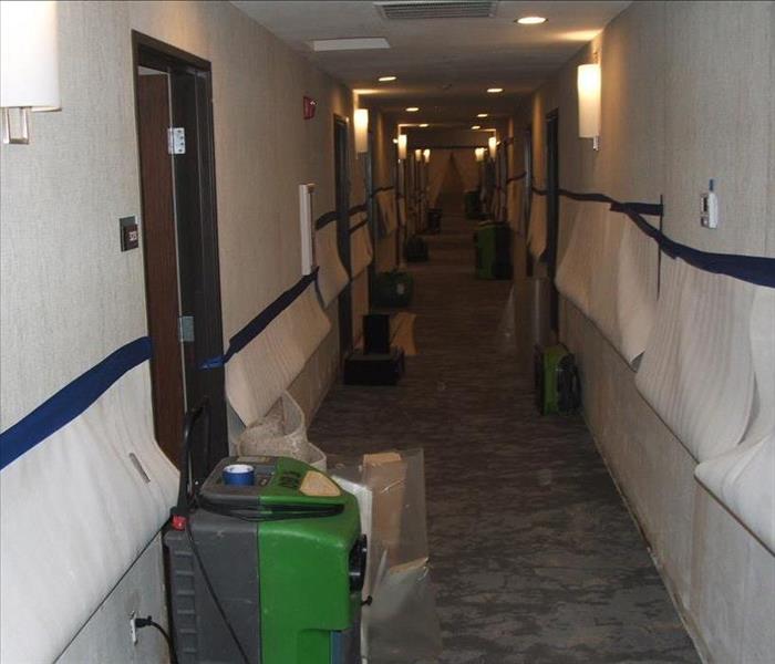Commercial hallway with drying equipment.